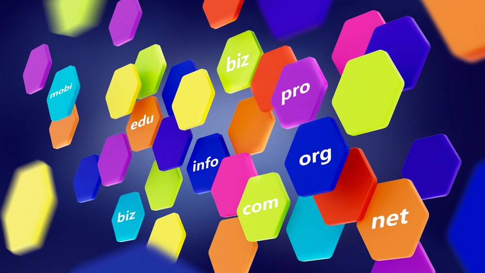 Colorful 3D tiles of domain name extensions including .com, .net, .org and .info — domains that must be renewed before they expire