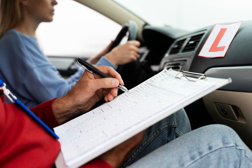 A safety manager reviewing a driver qualification file — application, MVR review, medical certificate, and certificate of violations — for DOT audit readiness