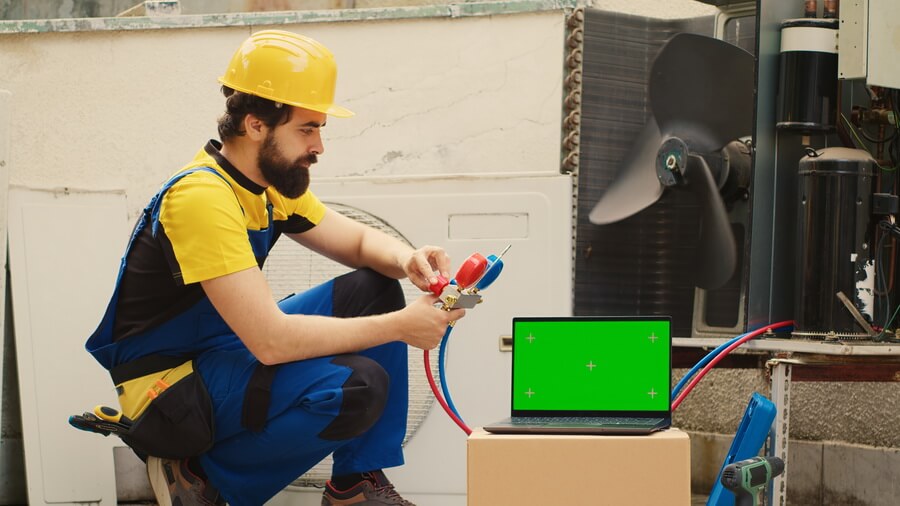 An HVAC technician servicing a rooftop unit while the office tracks the state license renewal and every technician's EPA 608 certification on file