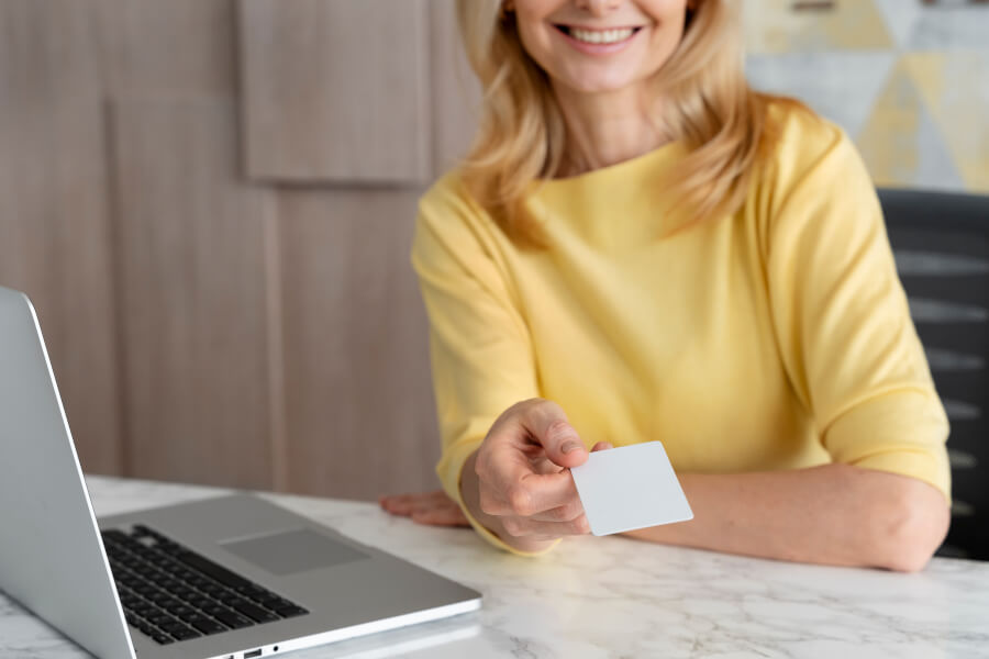 An HR administrator reviewing a Social Security card in an onboarding file and noting that it carries no expiration date, only work-authorization restriction wording that a status change can make outdated