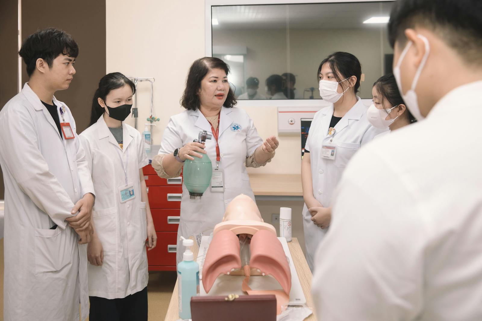 Medical students practicing BLS on mannequin