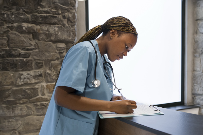 Hospital compliance team reviewing nursing license records to avoid regulatory violations
